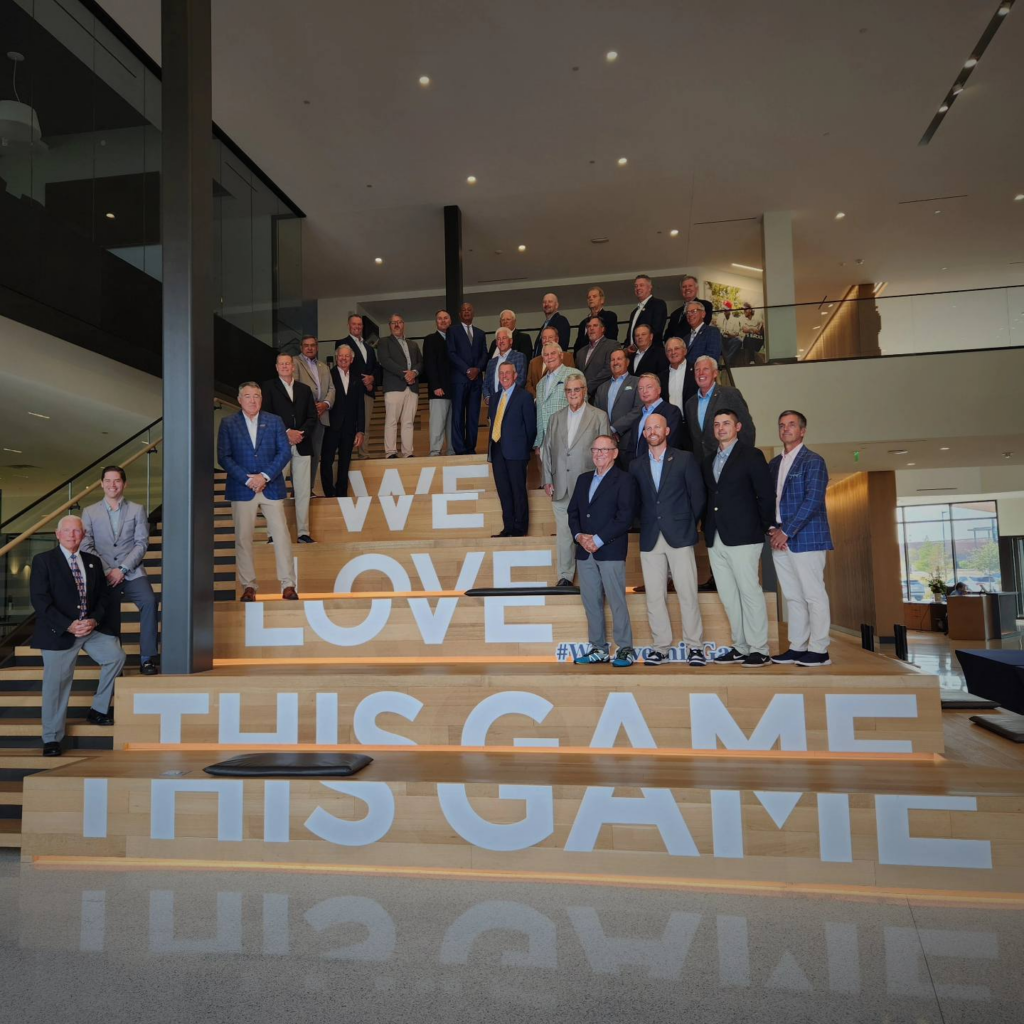 PGA of America members staniding onLove This Game staircase at PGA Headquarters in Frisco, TX