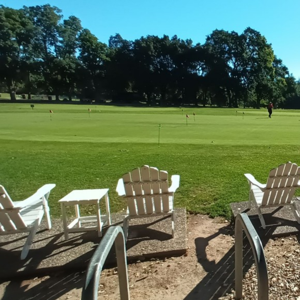 William Land Putting Green with White Chairs