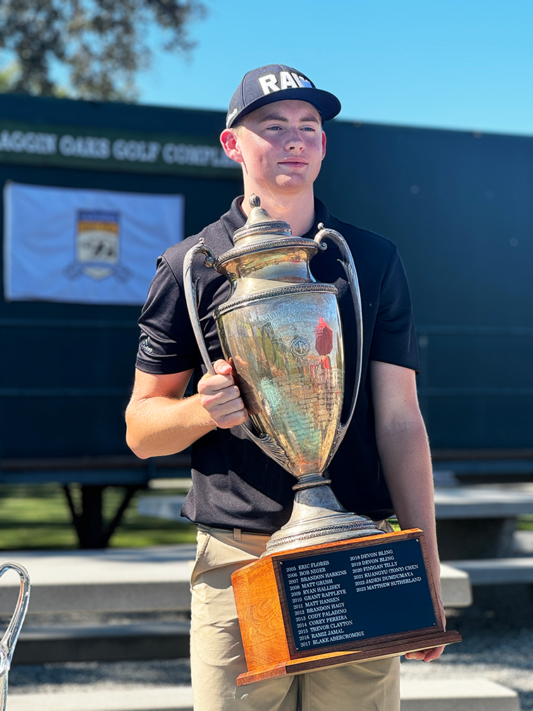 Emil Nielsen holding the California State Fair Golf Championship trophy