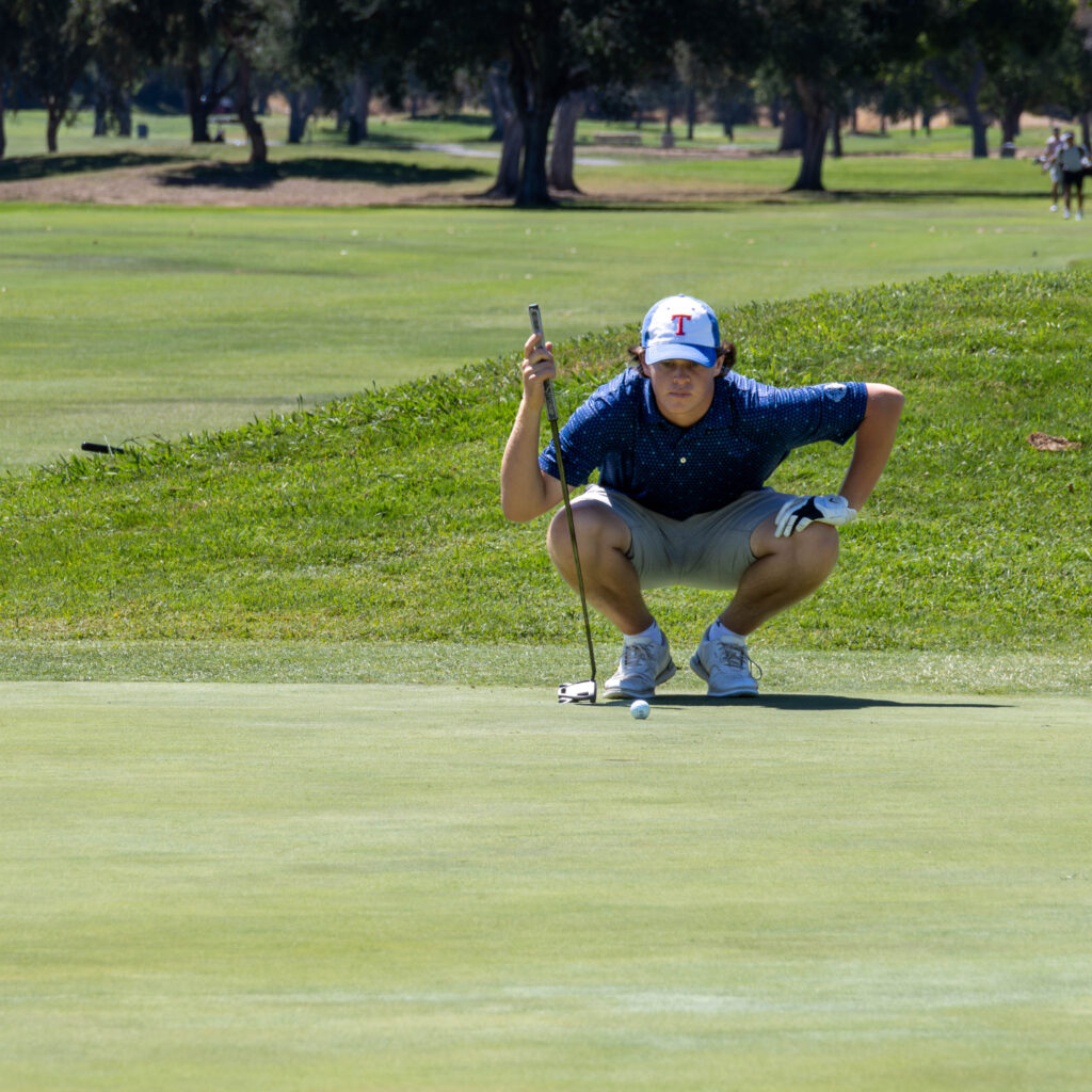 ben friedman putting on the 18th hole.