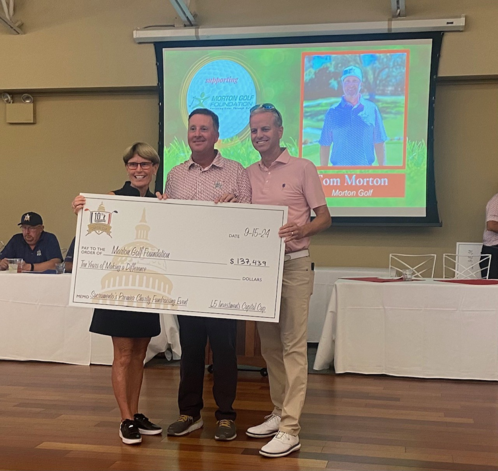 Jane Siebers, Tom Morton and Mike Woods hold Capital Cup Check for Morton Golf Foundation after tournament