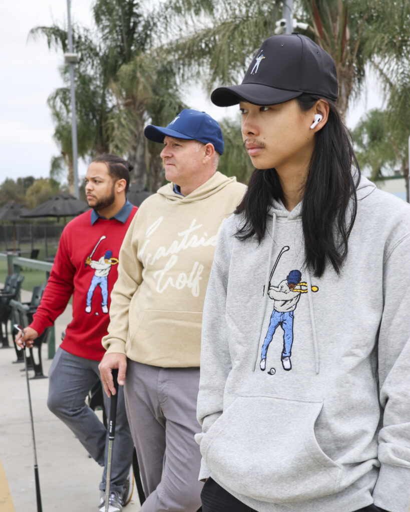 Three Young Men in Eastside Golf Apparel on the driving range