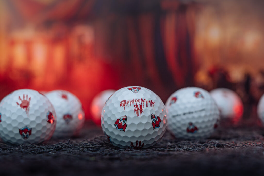 TaylorMade TP5 Golf Balls with scary clown faces and bloody handprint