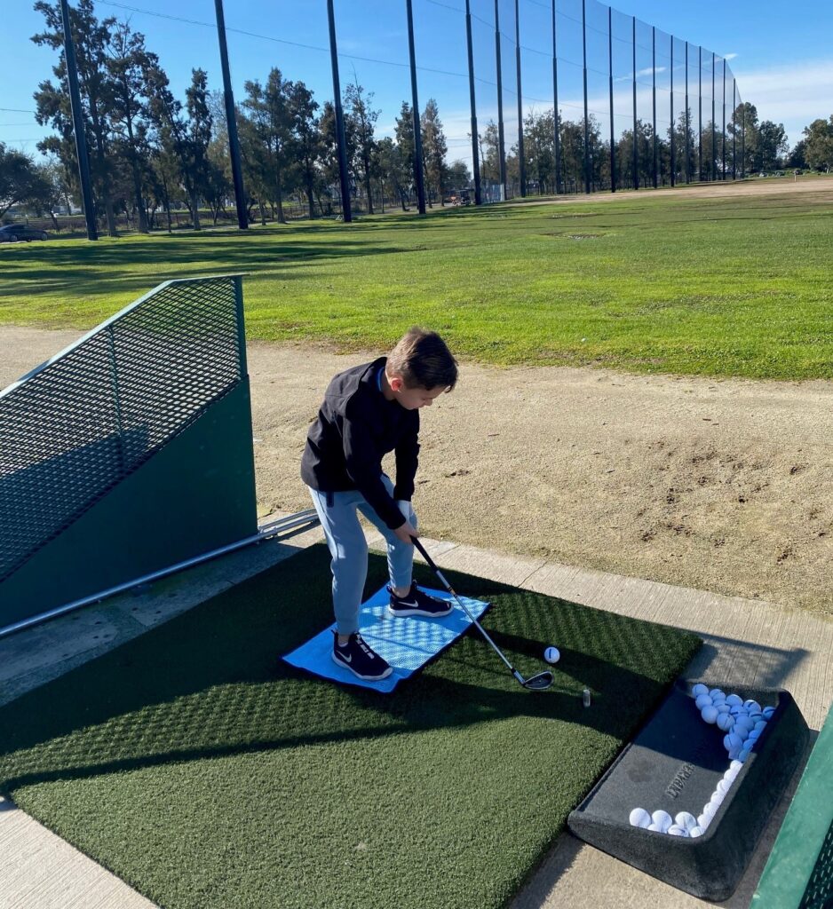 Junior Golfer on driving range